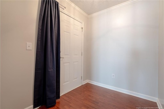3314 Harbour Pointe Pl Unit 8, Fayetteville, NC 28314 - empty room with dark wood-type flooring, a textured ceiling, and crown molding