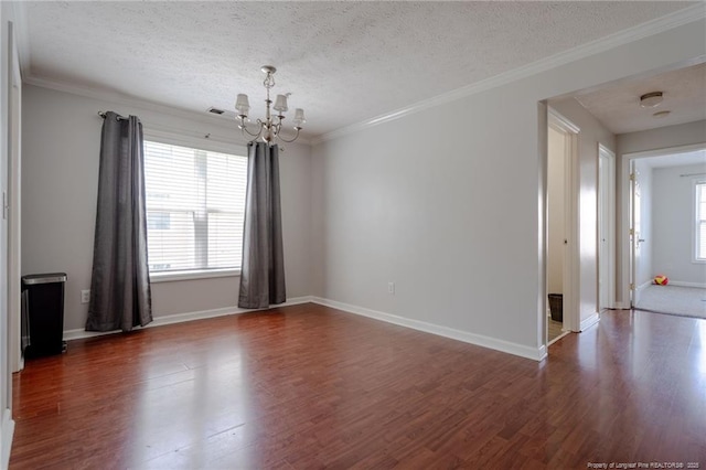 3314 Harbour Pointe Pl Unit 8, Fayetteville, NC 28314 - unfurnished room featuring a chandelier, dark wood-type flooring, a textured ceiling, and crown molding
