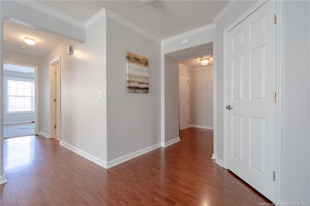 3314 Harbour Pointe Pl Unit 8, Fayetteville, NC 28314 - hallway with dark wood-type flooring, ornamental molding, and a textured ceiling