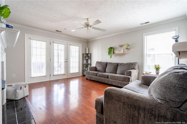 3314 Harbour Pointe Pl Unit 8, Fayetteville, NC 28314 - living area with a ceiling fan, wood finished floors, french doors, ornamental molding, and a textured ceiling