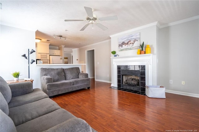 3314 Harbour Pointe Pl Unit 8, Fayetteville, NC 28314 - living room featuring wood finished floors, ceiling fan, ornamental molding, and a fireplace