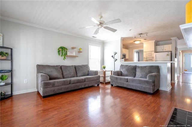 3314 Harbour Pointe Pl Unit 8, Fayetteville, NC 28314 - living area featuring wood finished floors, a ceiling fan, rail lighting, and ornamental molding