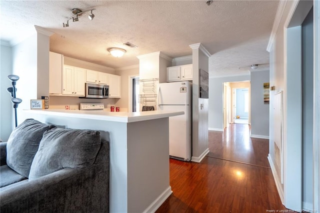 3314 Harbour Pointe Pl Unit 8, Fayetteville, NC 28314 - kitchen featuring freestanding refrigerator, stainless steel microwave, open floor plan, a textured ceiling, and crown molding