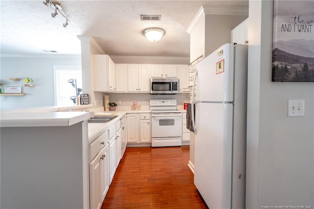 3314 Harbour Pointe Pl Unit 8, Fayetteville, NC 28314 - kitchen with white appliances, ornamental molding, white cabinets, dark wood-style floors, and a textured ceiling