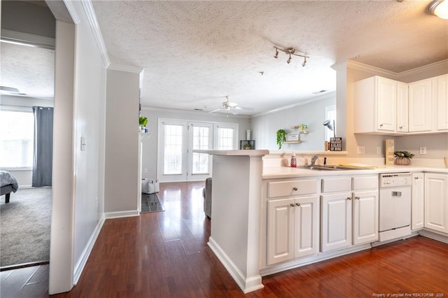 3314 Harbour Pointe Pl Unit 8, Fayetteville, NC 28314 - kitchen featuring dishwasher, crown molding, a textured ceiling, a peninsula, and white cabinetry