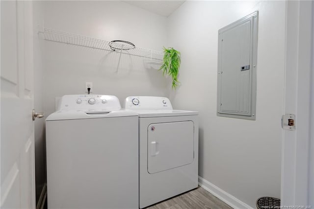 3314 Harbour Pointe Pl Unit 8, Fayetteville, NC 28314 - washroom with electric panel, washer and dryer, and light wood finished floors