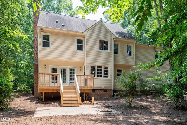 5020 Celbridge Pl, Raleigh, NC 27613 - rear view of house featuring a wooden deck, a chimney, crawl space, and a shingled roof