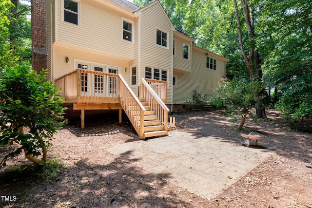 5020 Celbridge Pl, Raleigh, NC 27613 - back of property featuring a deck, crawl space, a patio area, and stairway
