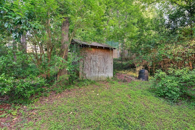 3215 Oxford Dr, Durham, NC 27707 - view of yard featuring a storage unit and a wooded view