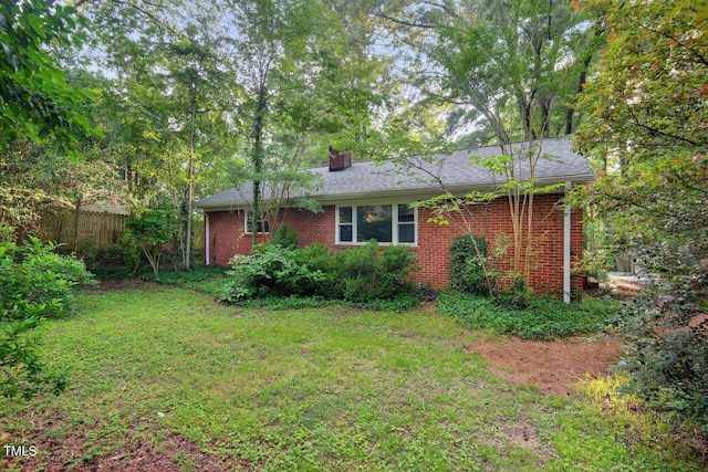 3215 Oxford Dr, Durham, NC 27707 - view of side of home featuring brick siding, a chimney, and a shingled roof