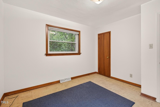 3215 Oxford Dr, Durham, NC 27707 - spare room featuring baseboards