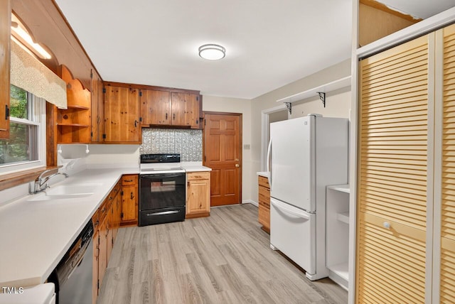3215 Oxford Dr, Durham, NC 27707 - kitchen featuring freestanding refrigerator, range with electric stovetop, open shelves, stainless steel dishwasher, and light wood-style floors