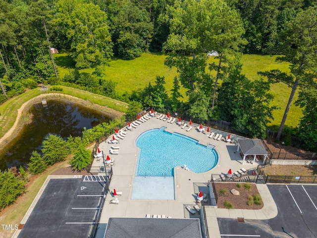 2712 Lake Waccamaw Trl, Apex, NC 27502 - community pool featuring a patio area and a view of trees