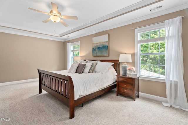 2712 Lake Waccamaw Trl, Apex, NC 27502 - carpeted bedroom with a tray ceiling, ornamental molding, and a ceiling fan