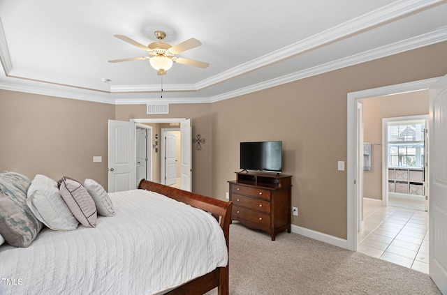 2712 Lake Waccamaw Trl, Apex, NC 27502 - bedroom with ornamental molding, light colored carpet, light tile patterned flooring, ceiling fan, and a tray ceiling