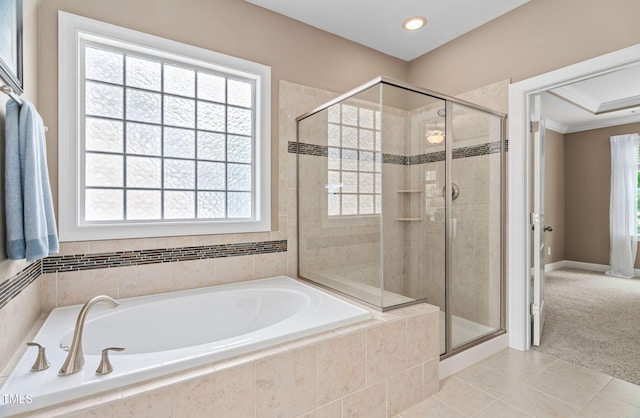 2712 Lake Waccamaw Trl, Apex, NC 27502 - bathroom featuring a garden tub, a shower stall, tile patterned flooring, healthy amount of natural light, and crown molding