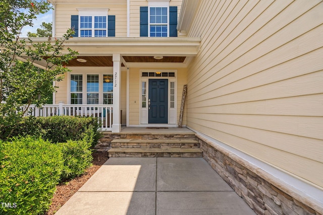 2712 Lake Waccamaw Trl, Apex, NC 27502 - doorway to property featuring covered porch