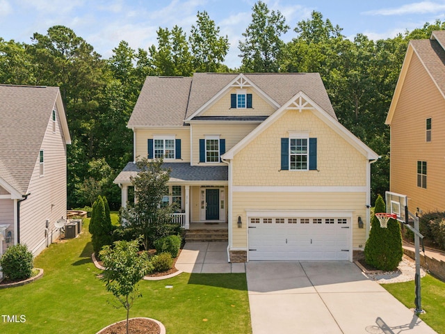2712 Lake Waccamaw Trl, Apex, NC 27502 - craftsman house featuring an attached garage, concrete driveway, a front yard, covered porch, and roof with shingles