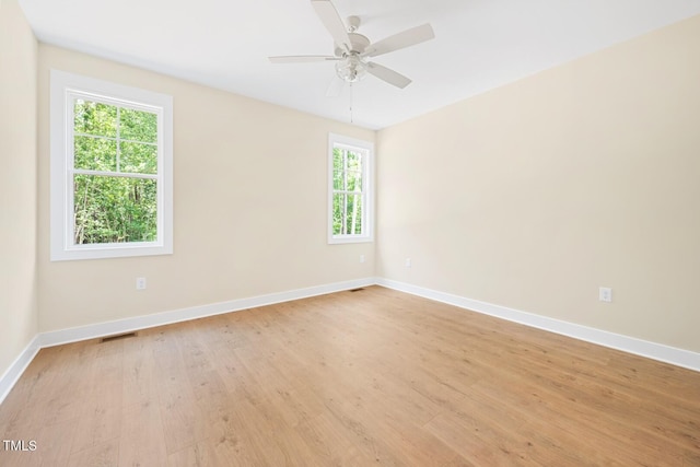 140 Purslane Dr, Franklinton, NC 27525 - spare room featuring healthy amount of natural light, light wood finished floors, and a ceiling fan