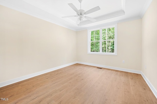 140 Purslane Dr, Franklinton, NC 27525 - spare room featuring light wood-type flooring, ornamental molding, a tray ceiling, and ceiling fan