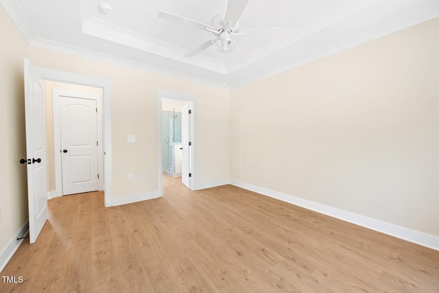 140 Purslane Dr, Franklinton, NC 27525 - unfurnished bedroom with a tray ceiling, light wood finished floors, ornamental molding, ensuite bathroom, and a ceiling fan