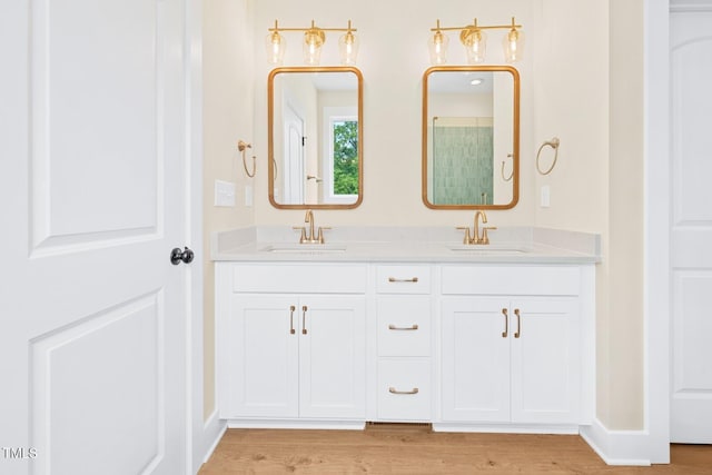 140 Purslane Dr, Franklinton, NC 27525 - bathroom featuring double vanity, wood finished floors, and a shower