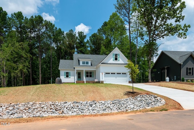 140 Purslane Dr, Franklinton, NC 27525 - modern farmhouse style home with concrete driveway, a front yard, and an attached garage