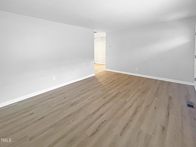 845 Newcombe Rd, Raleigh, NC 27610 - unfurnished room with baseboards and wood finished floors