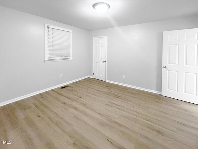 845 Newcombe Rd, Raleigh, NC 27610 - empty room with baseboards and wood finished floors