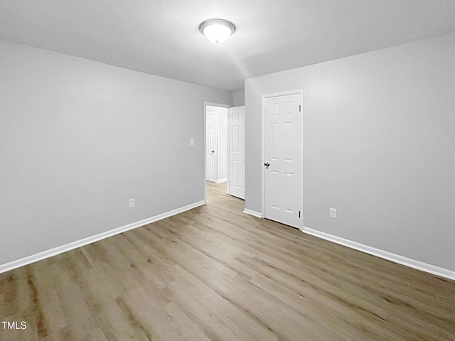 845 Newcombe Rd, Raleigh, NC 27610 - spare room with wood finished floors and baseboards