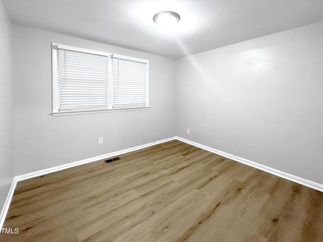 845 Newcombe Rd, Raleigh, NC 27610 - spare room with baseboards and wood finished floors