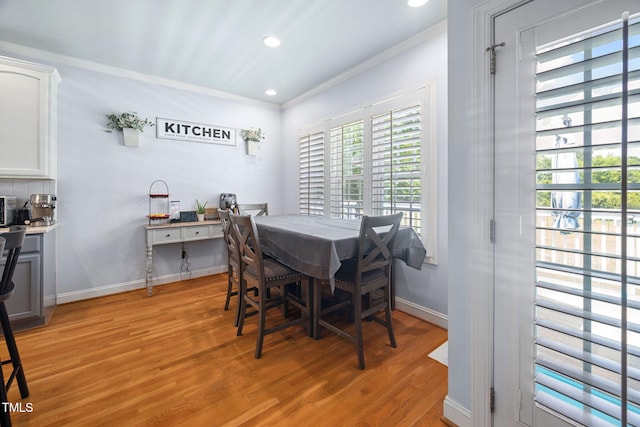1824 Ferrell Meadows Dr, Zebulon, NC 27597 - dining space featuring crown molding, light wood-style floors, and recessed lighting