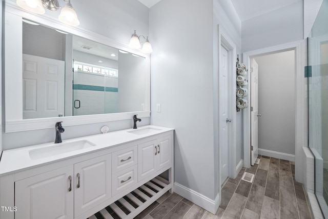 1824 Ferrell Meadows Dr, Zebulon, NC 27597 - bathroom with a shower stall, wood finish floors, and double vanity