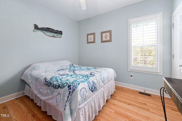 1824 Ferrell Meadows Dr, Zebulon, NC 27597 - bedroom with wood finished floors and ceiling fan