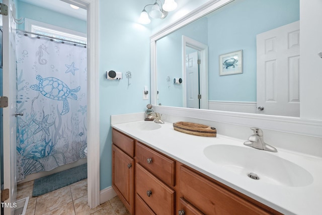 1824 Ferrell Meadows Dr, Zebulon, NC 27597 - bathroom featuring double vanity, a shower with shower curtain, and tile patterned floors