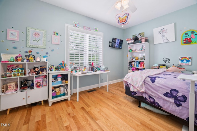 1824 Ferrell Meadows Dr, Zebulon, NC 27597 - bedroom featuring wood finished floors and a ceiling fan