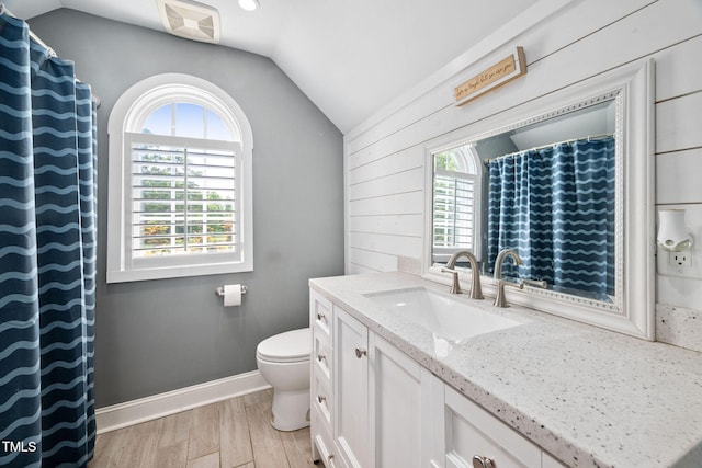 1824 Ferrell Meadows Dr, Zebulon, NC 27597 - bathroom with vaulted ceiling, vanity, and wood finished floors
