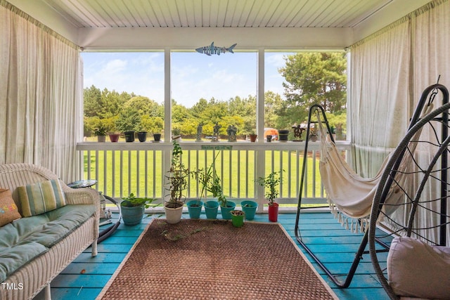 1824 Ferrell Meadows Dr, Zebulon, NC 27597 - sunroom / solarium featuring an outdoor hangout area and hardwood / wood-style floors