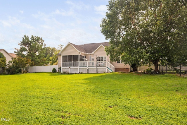 1824 Ferrell Meadows Dr, Zebulon, NC 27597 - rear view of house with a sunroom, a fenced backyard, and stairs
