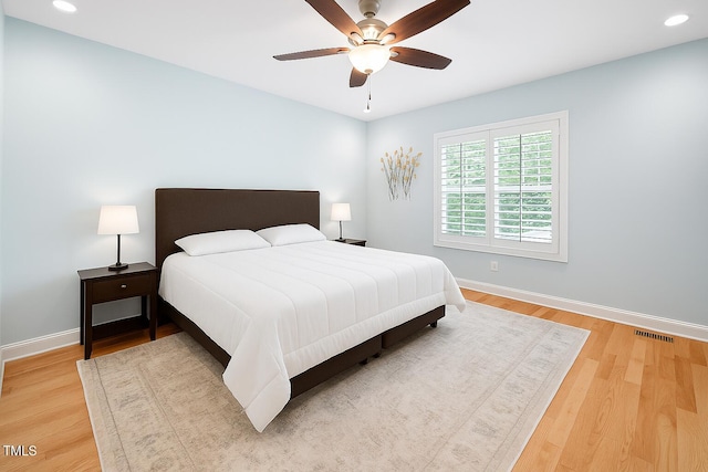 1824 Ferrell Meadows Dr, Zebulon, NC 27597 - bedroom with light wood finished floors, recessed lighting, and ceiling fan