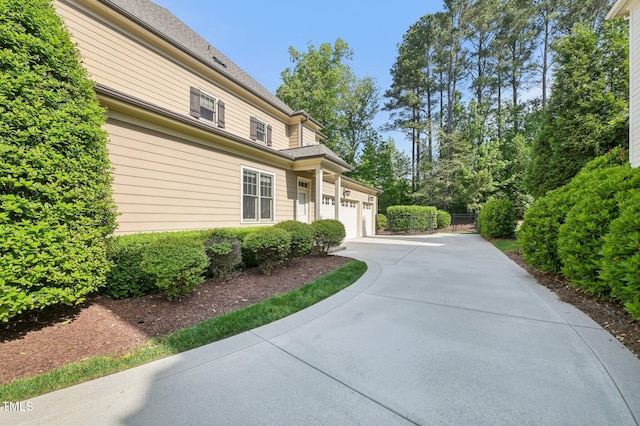 528 Bankhead Dr, Cary, NC 27519 - view of side of property featuring driveway and an attached garage