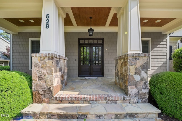 528 Bankhead Dr, Cary, NC 27519 - view of exterior entry with stone siding and a porch