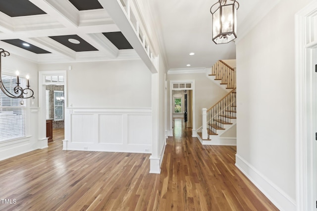 528 Bankhead Dr, Cary, NC 27519 - entryway featuring a chandelier, plenty of natural light, ornamental molding, stairway, and wood finished floors