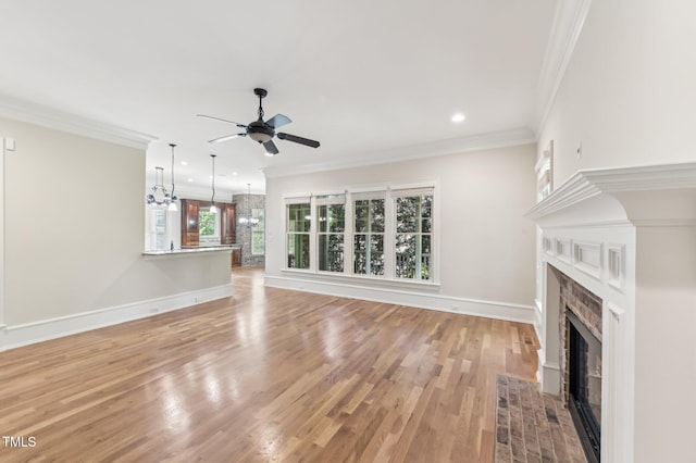 528 Bankhead Dr, Cary, NC 27519 - unfurnished living room featuring a fireplace with flush hearth, ceiling fan, crown molding, light wood-type flooring, and recessed lighting