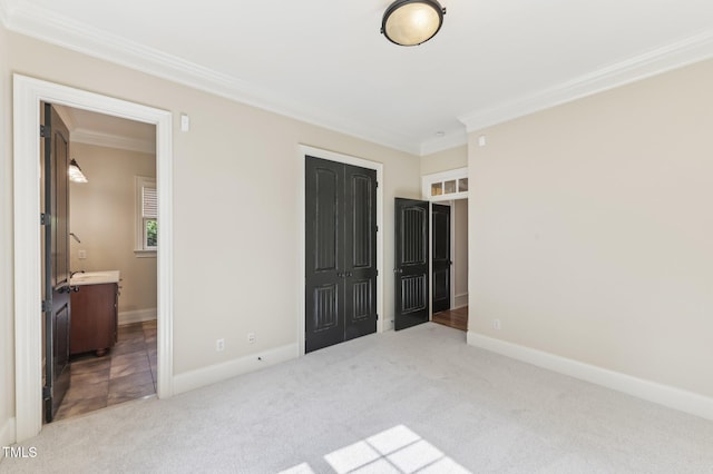528 Bankhead Dr, Cary, NC 27519 - unfurnished bedroom with crown molding, carpet, a closet, and connected bathroom