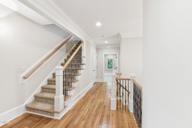 528 Bankhead Dr, Cary, NC 27519 - staircase featuring wood finished floors, ornamental molding, and recessed lighting
