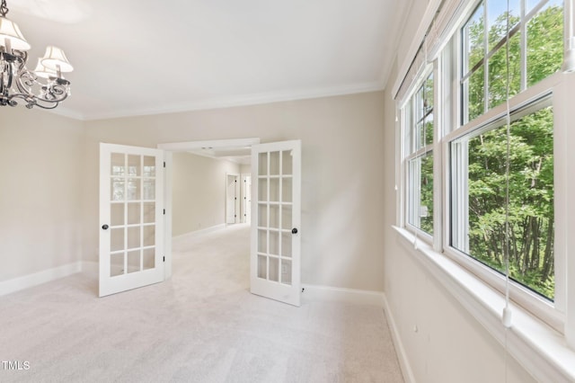 528 Bankhead Dr, Cary, NC 27519 - spare room featuring french doors, ornamental molding, a chandelier, and carpet flooring