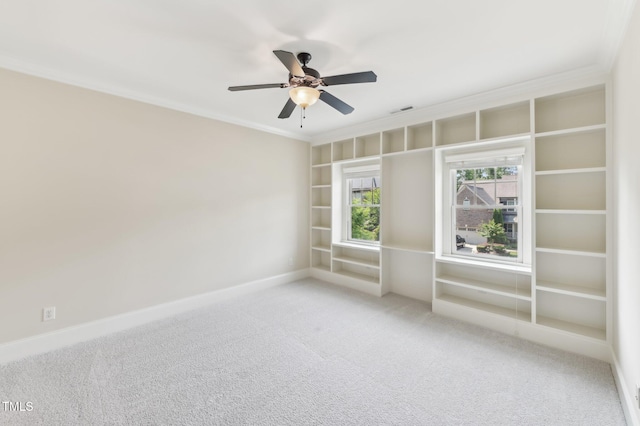 528 Bankhead Dr, Cary, NC 27519 - carpeted empty room with crown molding, built in features, and ceiling fan