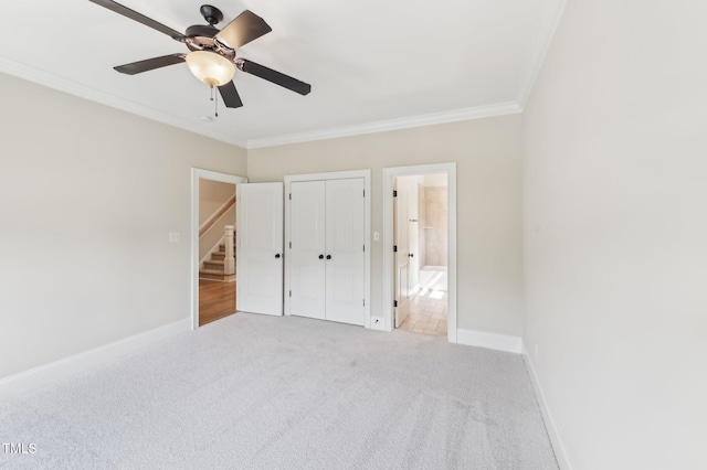 528 Bankhead Dr, Cary, NC 27519 - unfurnished bedroom featuring ornamental molding, carpet floors, ensuite bathroom, a closet, and a ceiling fan