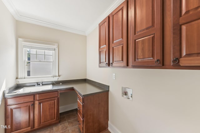 528 Bankhead Dr, Cary, NC 27519 - washroom with washer hookup, ornamental molding, cabinet space, and dark tile patterned flooring